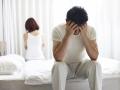 Angry couple in their bedroom, wondering if Shockwave Therapy is necessary for ED (Erectile Dysfunction)