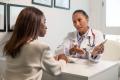 Doctor treating a patient to prevent recurrent urinary tract infection (UTI) or chronic urinary tract infection (UTI)