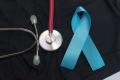Image of a stethoscope, a blue ribbon on a black background representing mourning for prostate cancer.