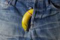 Banana condom on a jeans background representing an erectile dysfunction quiz