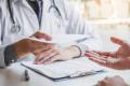 Doctor diagnosing a man with a urinary tract infection